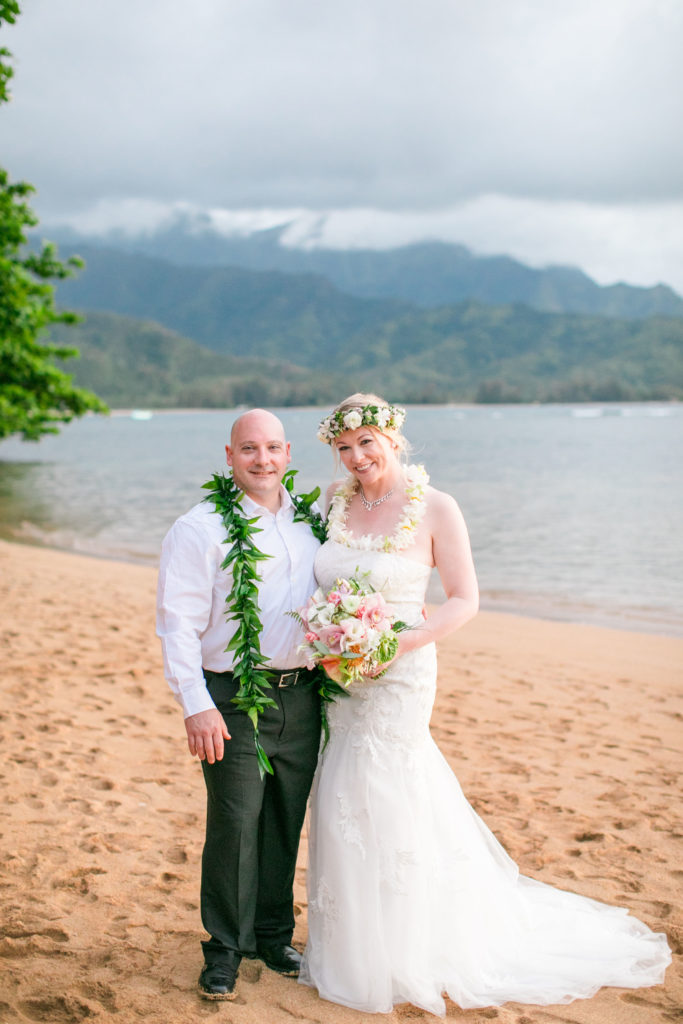 Bride and groom on the beach in Kauai.