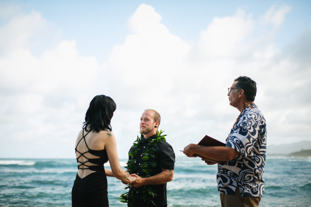 Couple eloping on the beach in Kauai.
