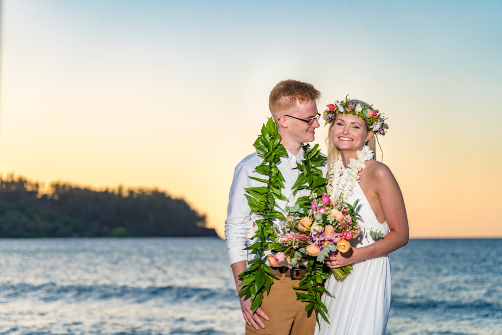 Bride and groom on the beach in Kauai.