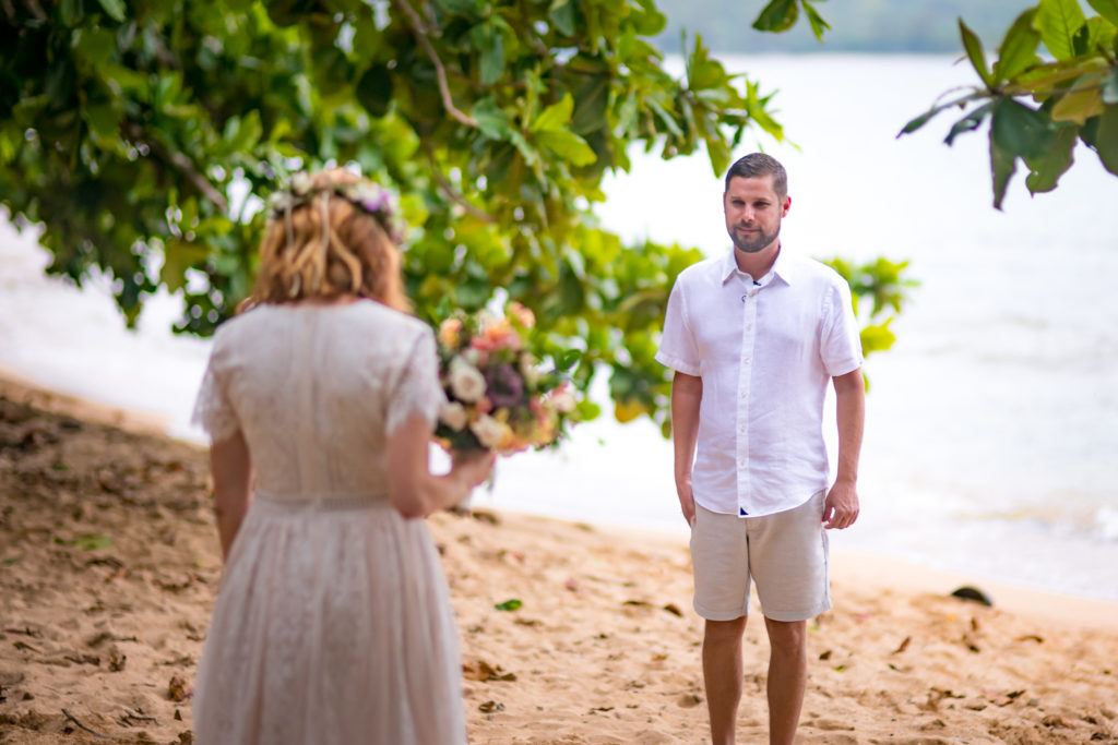 Bride and groom on the beach in Hawaii.