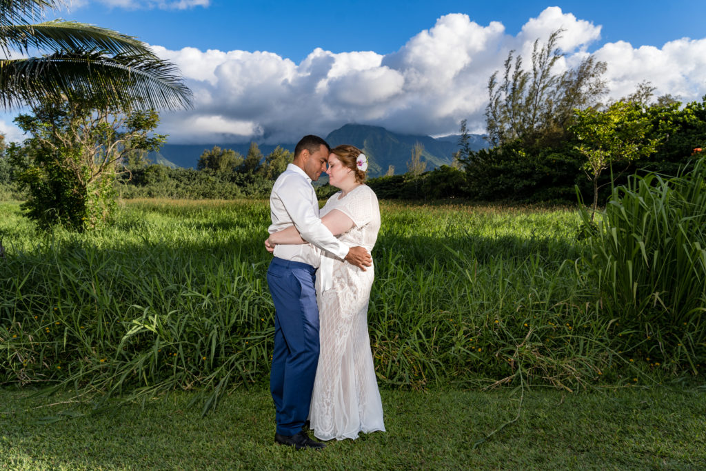 Bride and Groom posing for photographer.