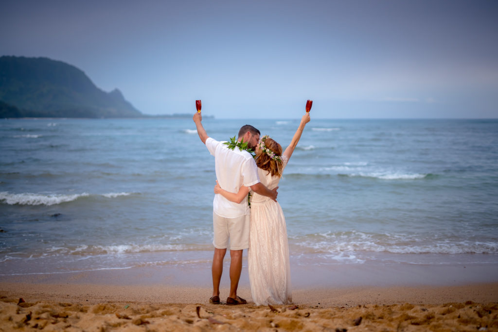 Husband and wife on the beach in Kauai.