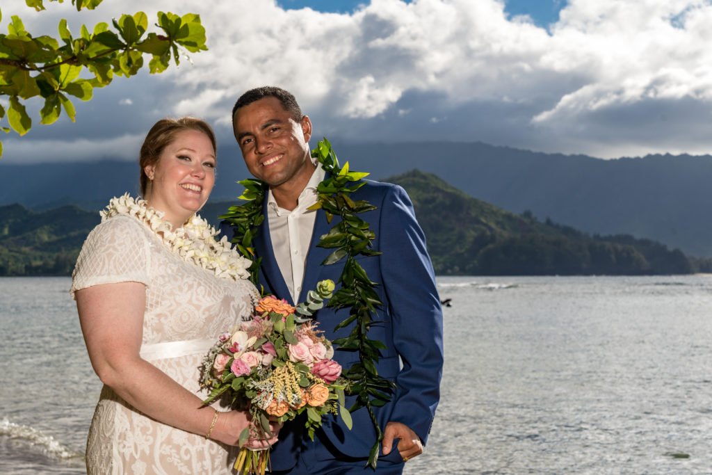 Bride and groom on the beach in Kauai.