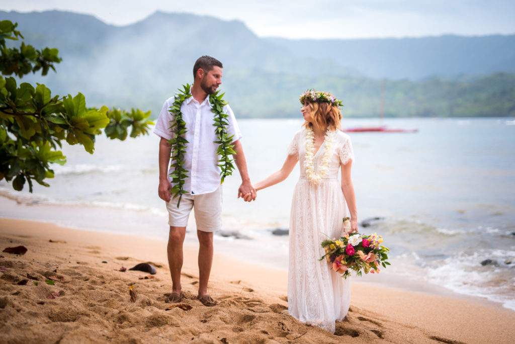 Bride and groom on the beach in Hawaii.