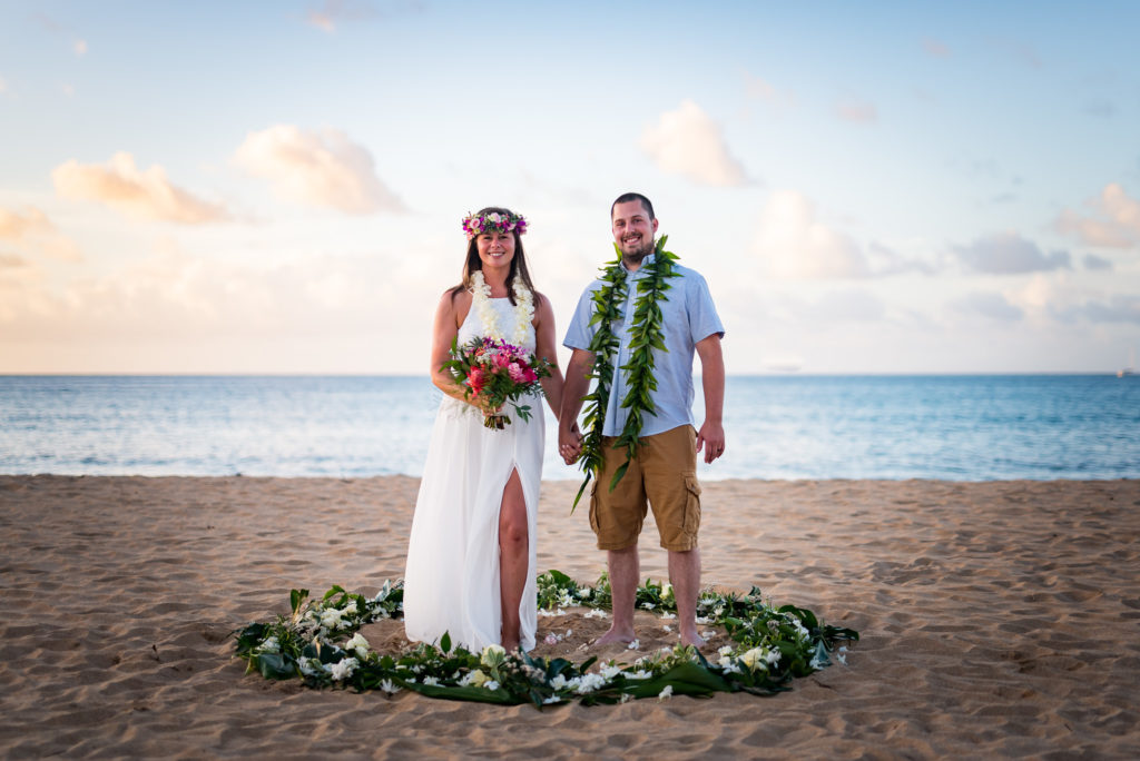 Husband and wife on the beach in Kauai.