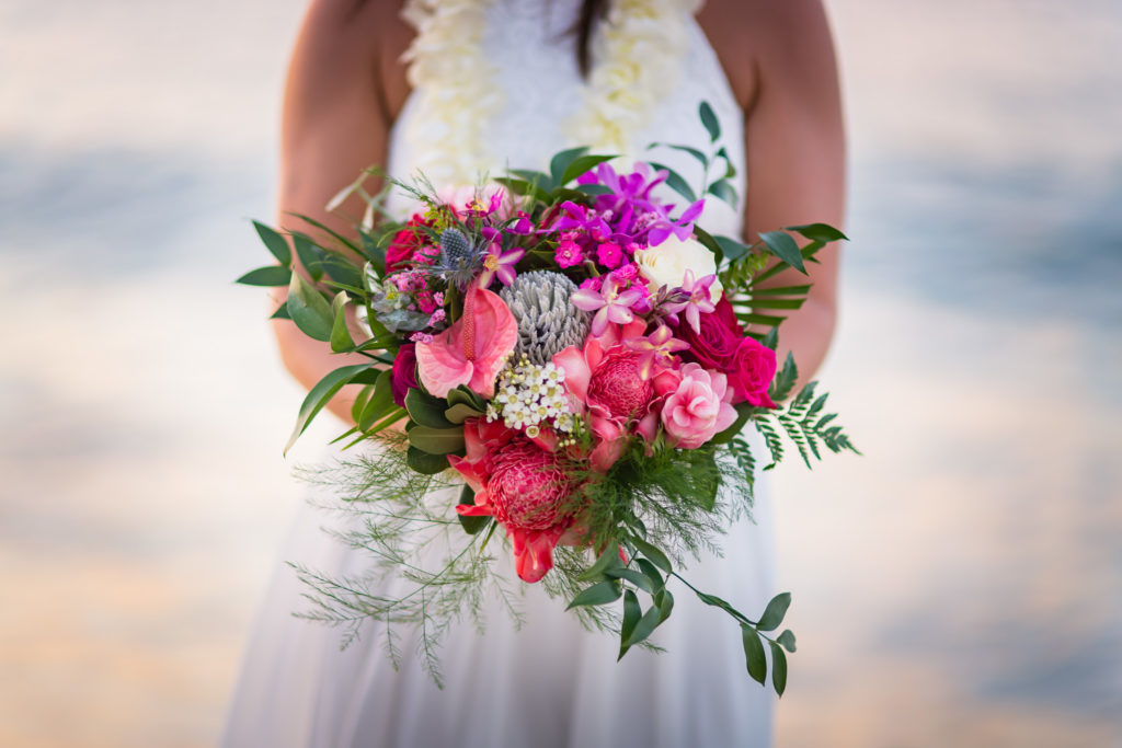Bride holding flowers.