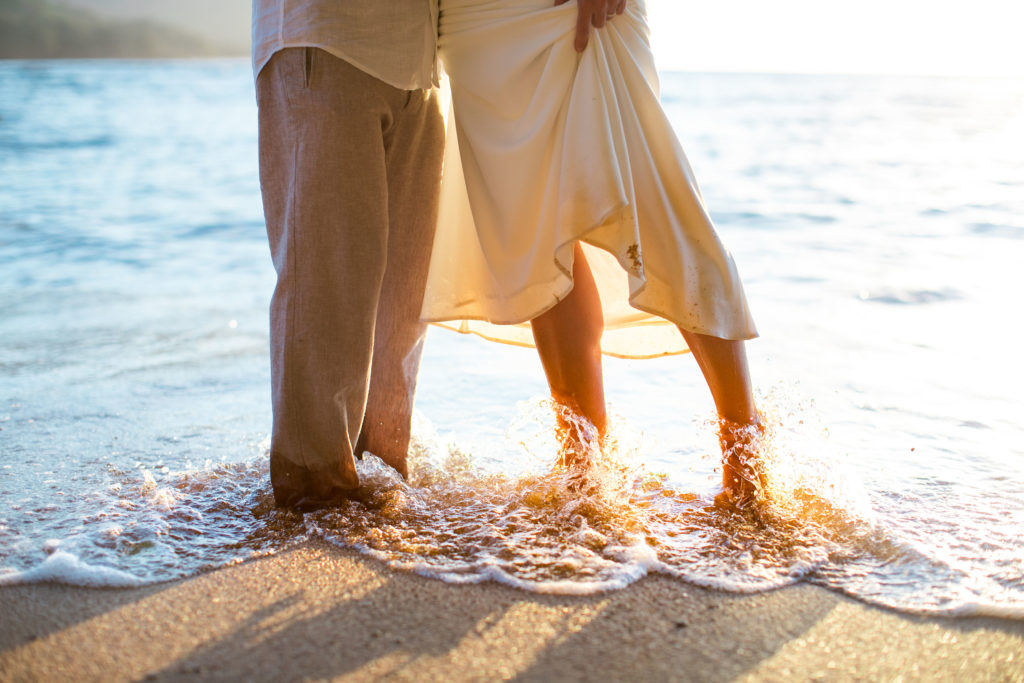 Bride and groom on the beach.