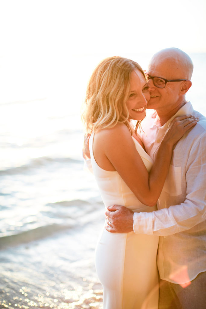 Bride and groom on the beach in Kauai.