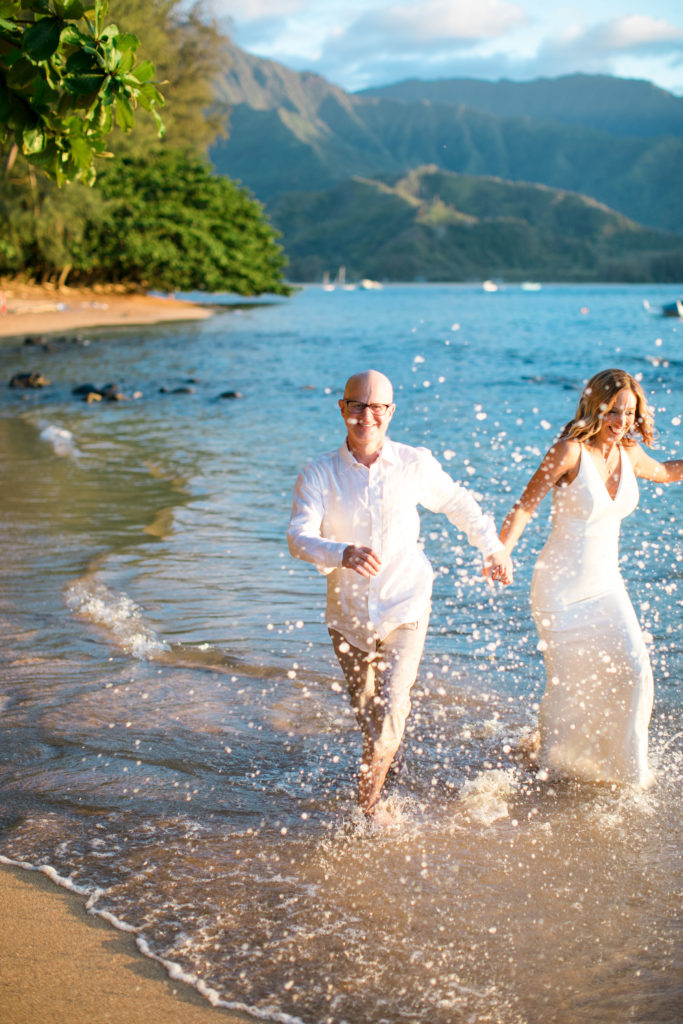 Walking in the water on the beach.