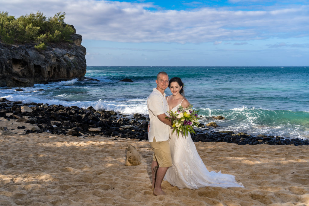 Bride and groom on the beach.