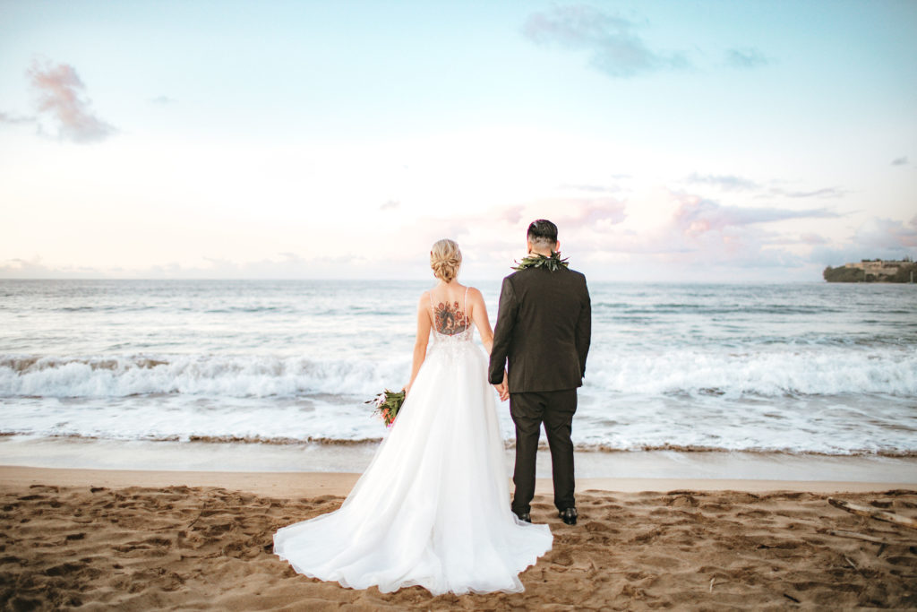 Bride and groom on the beach.