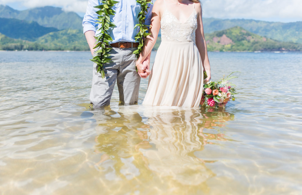 Bride and Groom in water in Kauai.