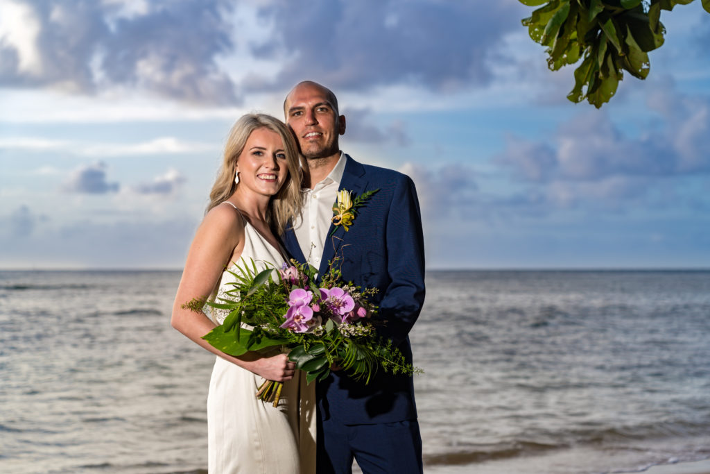 Bride and groom on the beach.