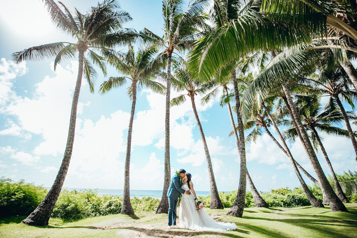 Gabriel & Darlenne getting married on the beach in Hawaii.