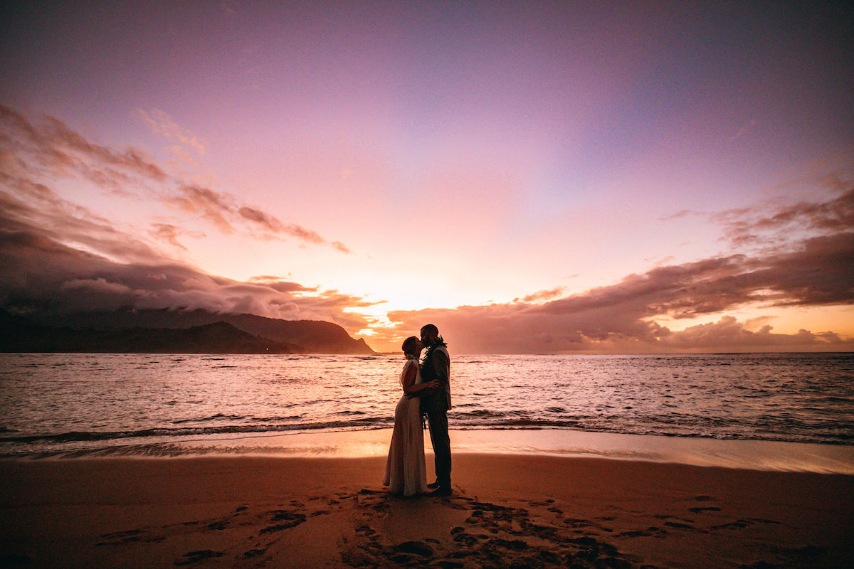 Amanda and Bryan on the beach at sunset.