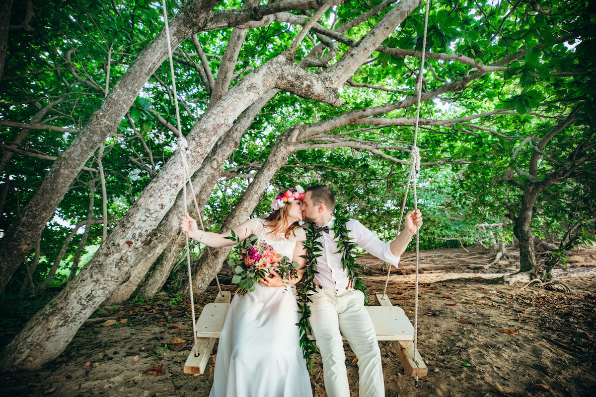 Georg & Janet under a tree on the beach.