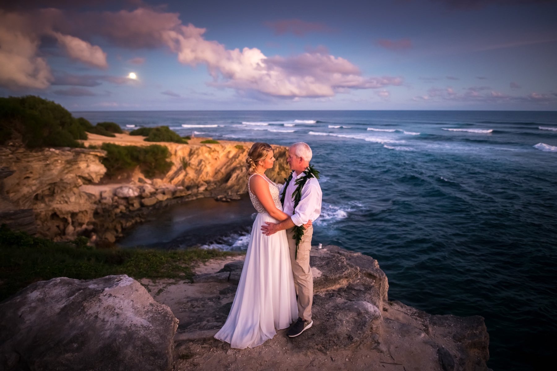 Todd & Angela on rocks overlooking the ocean.