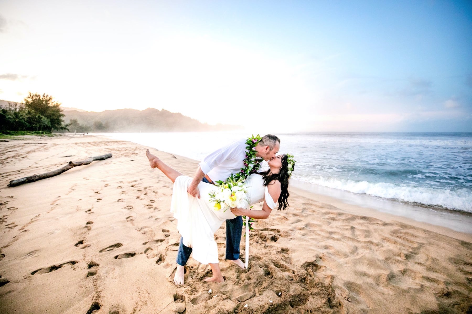 Cassandra & Alex on the beach in Kauai.