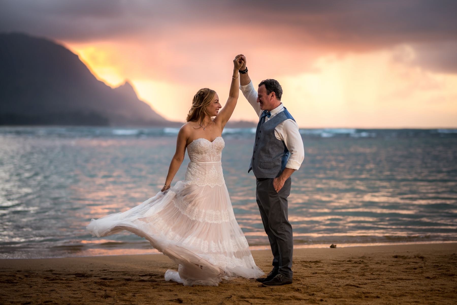 Nadia & Oriel on the beach at sunset.
