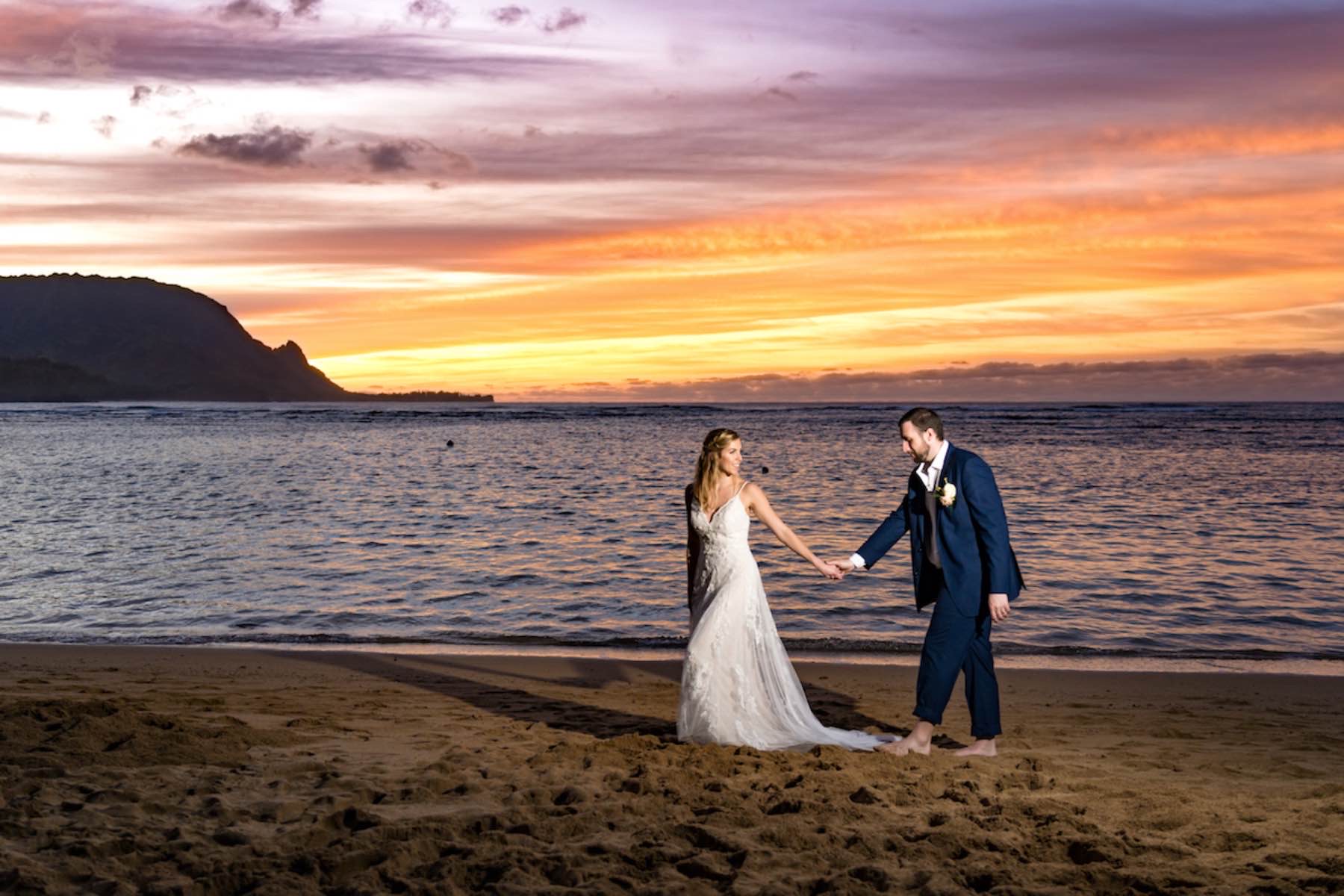 Sarah & Brian on Hawaiian beach at sunset.