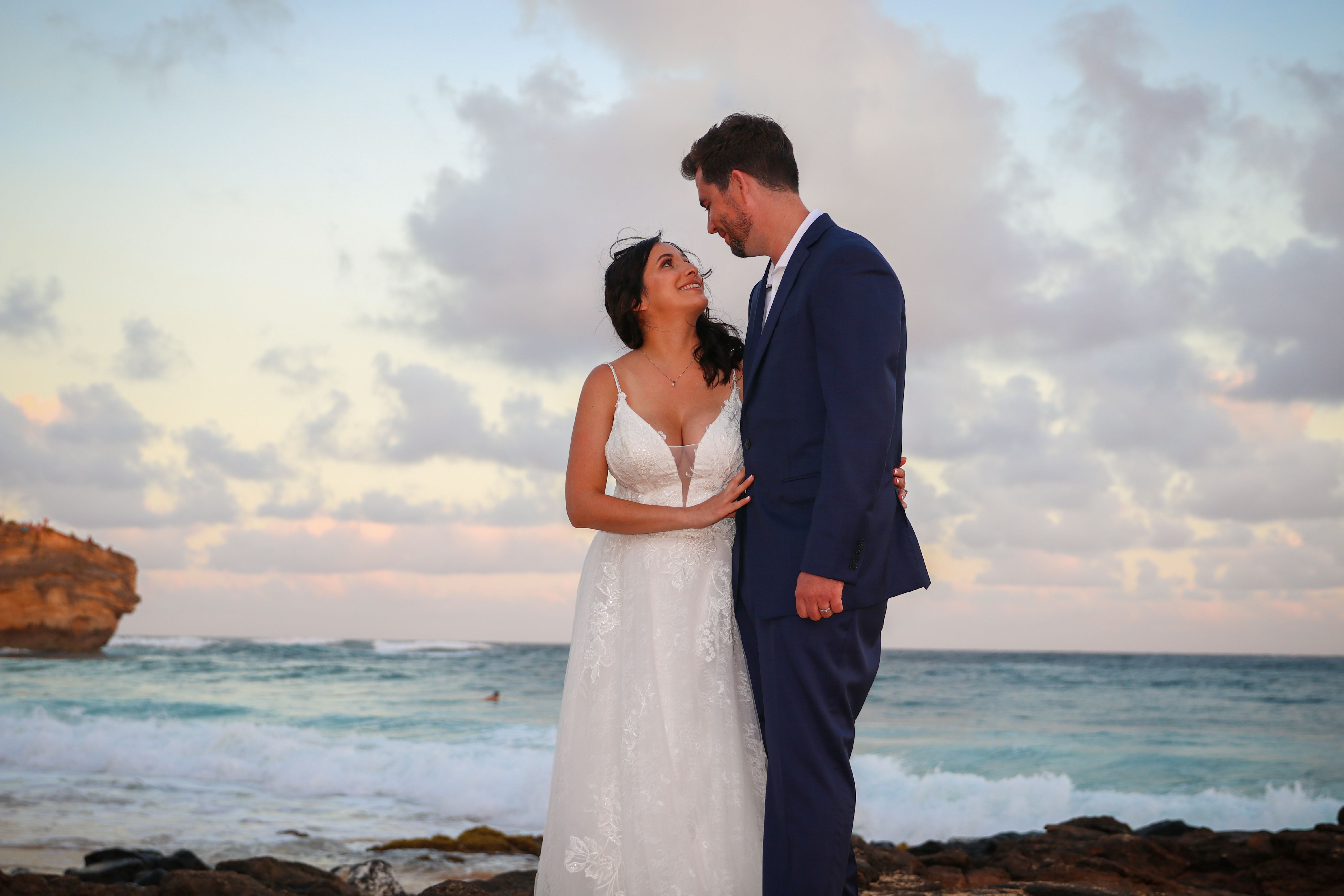 Kauai Elopement couple at sunset at Shipwrecks beach