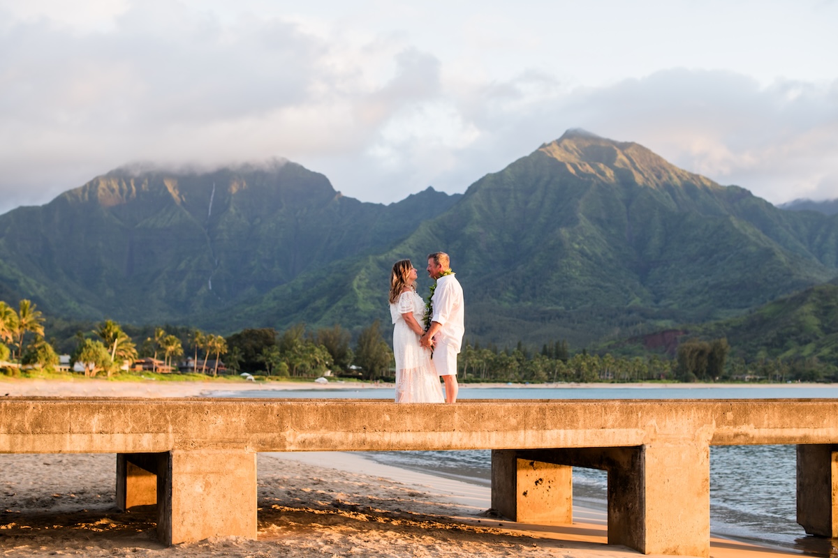 Such a beautiful vow renewal for Teresa & David on Hanalei Bay. It was a perfect day with Kahu Chuck officiating over their 20th wedding anniversary renewal of vows. Photos by Rachel Crain!