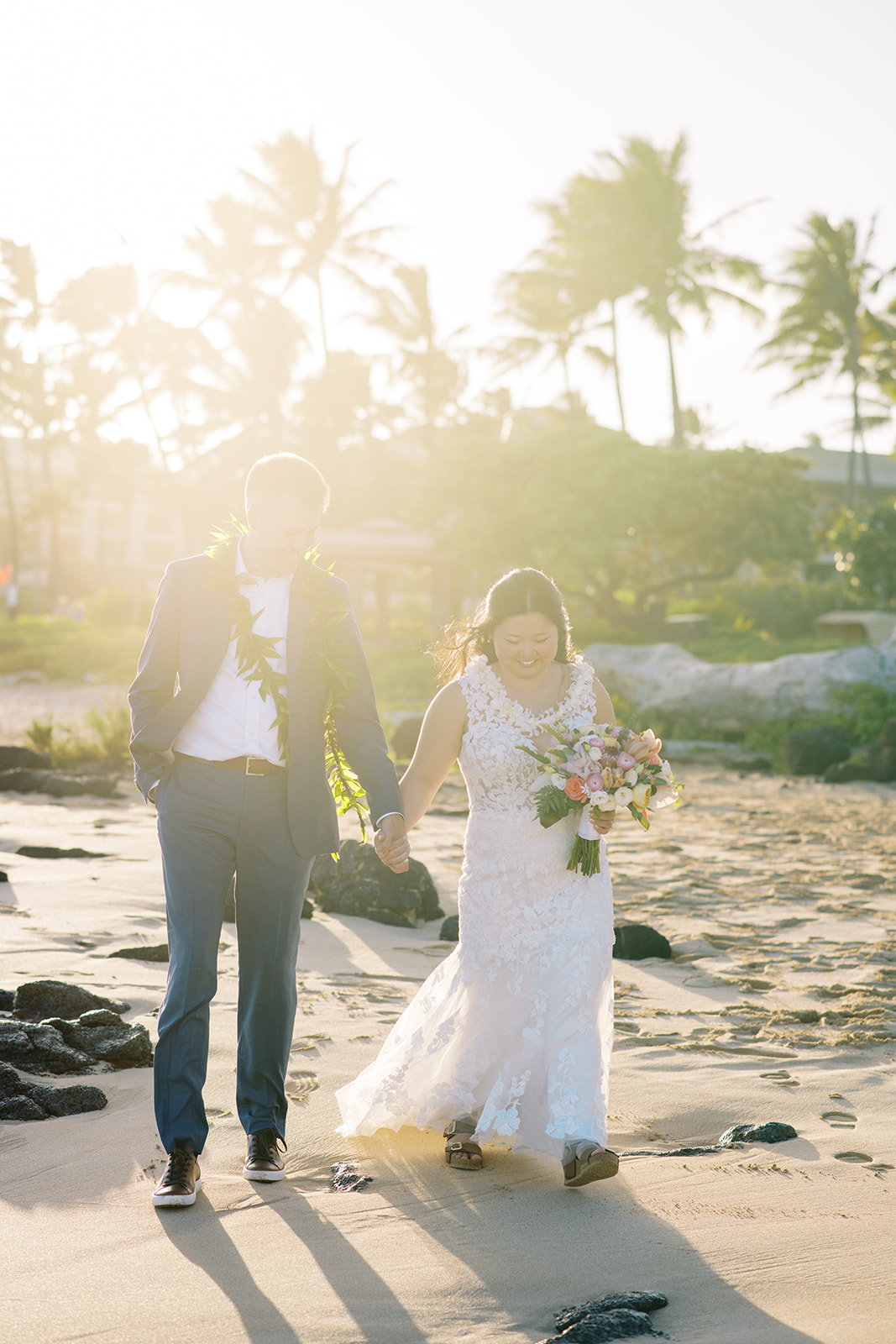 Greta and Nathan get married at Shipwrecks beach on Kauai