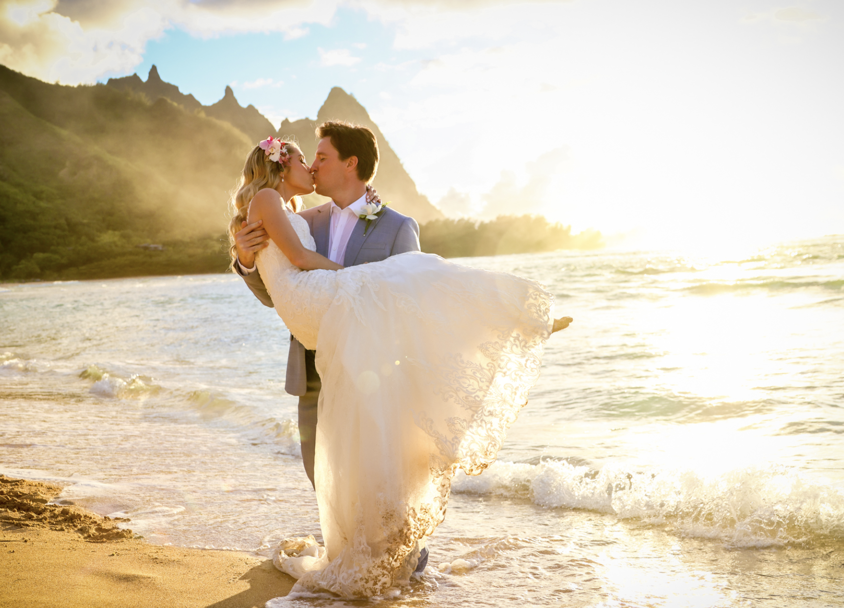 Newly weds kissing at sunset on Kauai