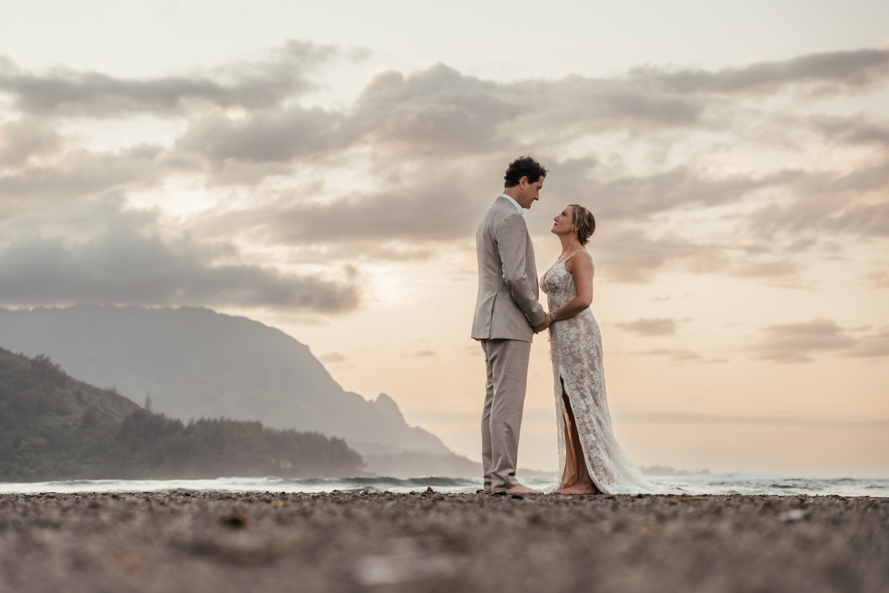 Couple on the beach in Hanalei Bay.
