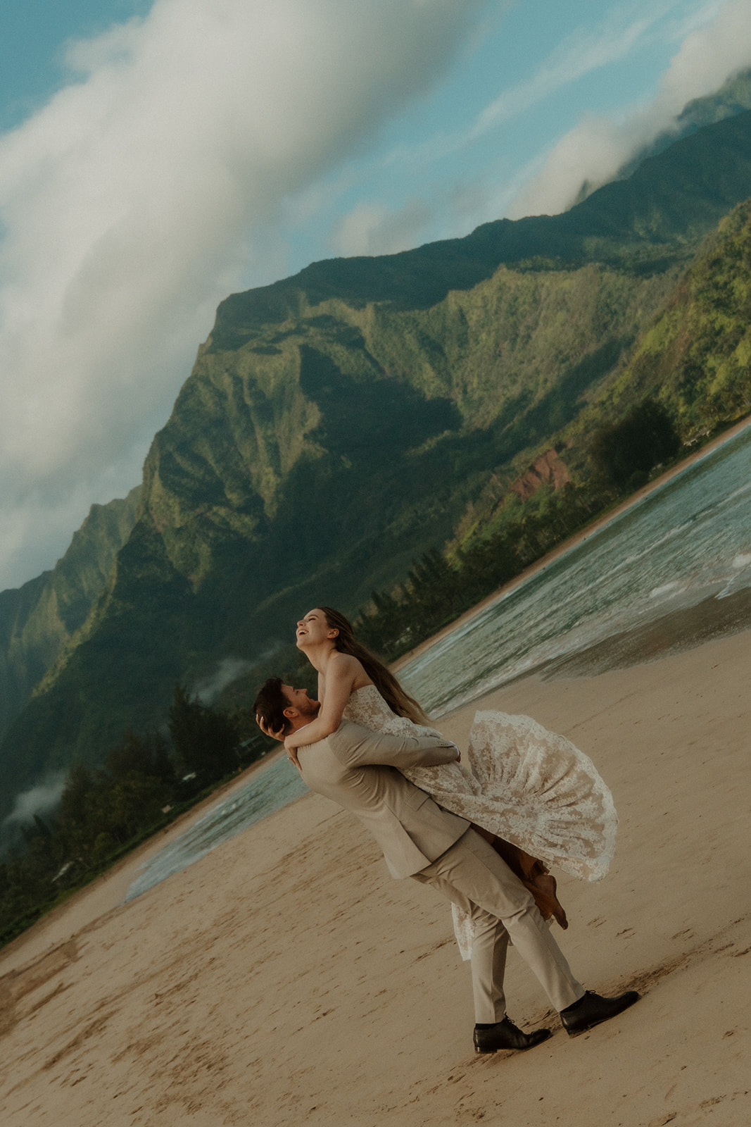Couple on the beach in Hanalei Bay.