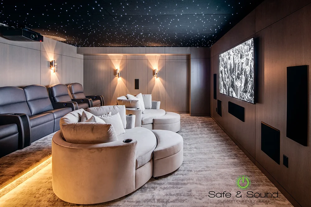 Luxury private cinema featuring cuddle couch seating and custom home theater recliners by Elite HTS