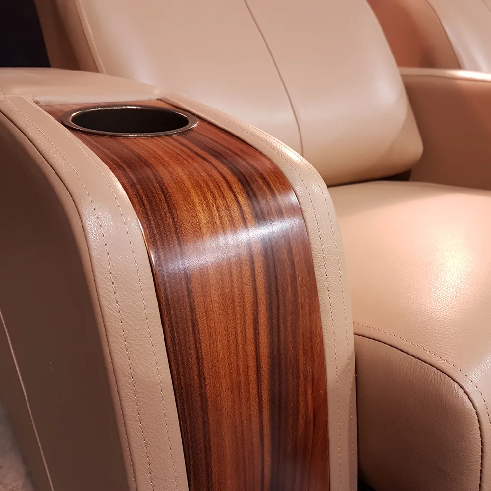 Close-up of wood trim armrest detail on custom home theater seating by Elite HTS