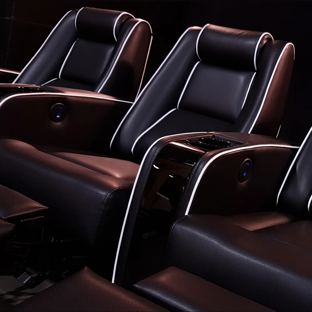 Luxury home theater seating with power recline and integrated armrest controls by Elite HTS
