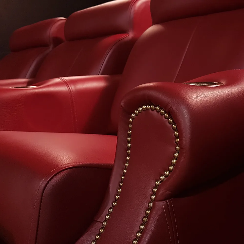Home theater seating models featuring classic nailhead trim and red leather upholstery by Elite HTS
