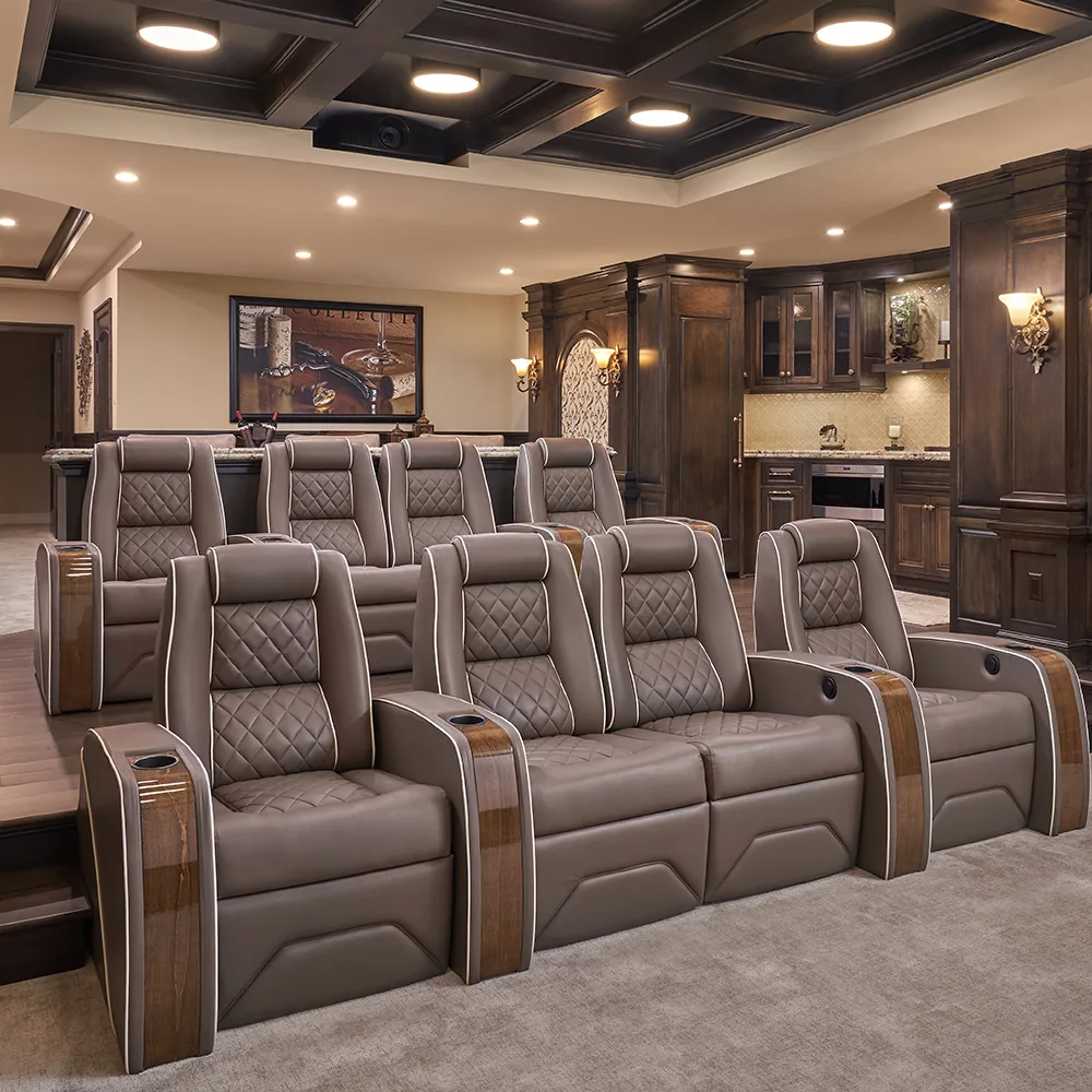 Luxury media room featuring custom theater seating and integrated bar by Elite HTS