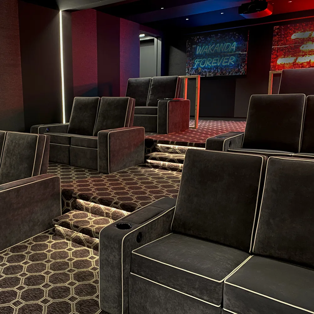 Custom private cinema with tiered seating installed by Elite HTS