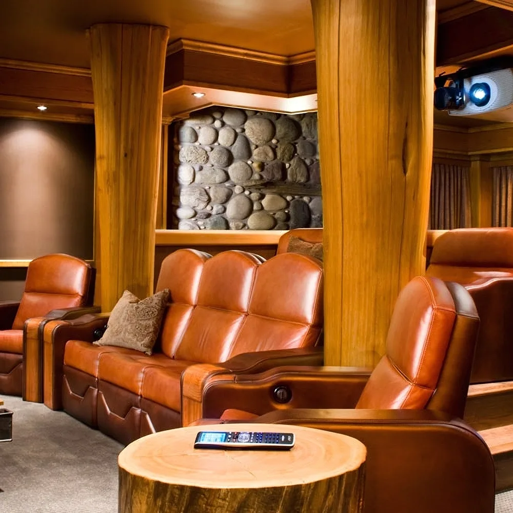Luxury media room with leather theater seating by Elite HTS