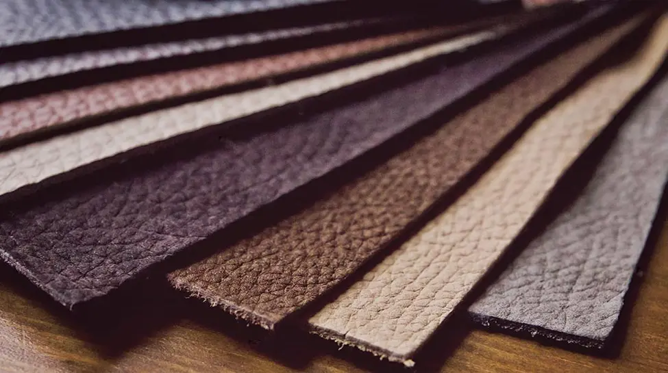 Array of Elite HTS leather and fabric swatches in assorted colors and textures