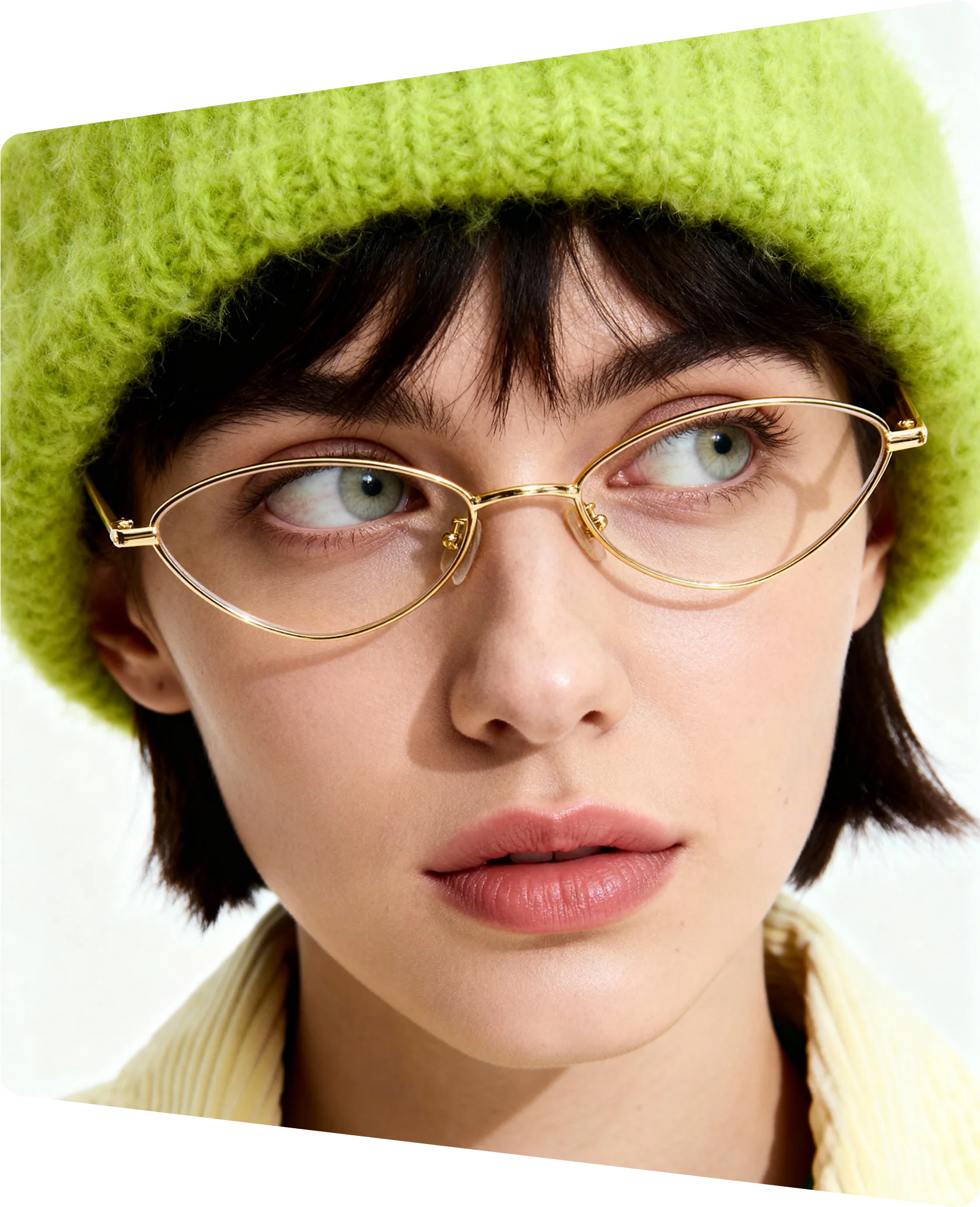 Embroidered patch depicting snow-capped mountains, evergreen trees, and a yellow sun on a blue sky background.