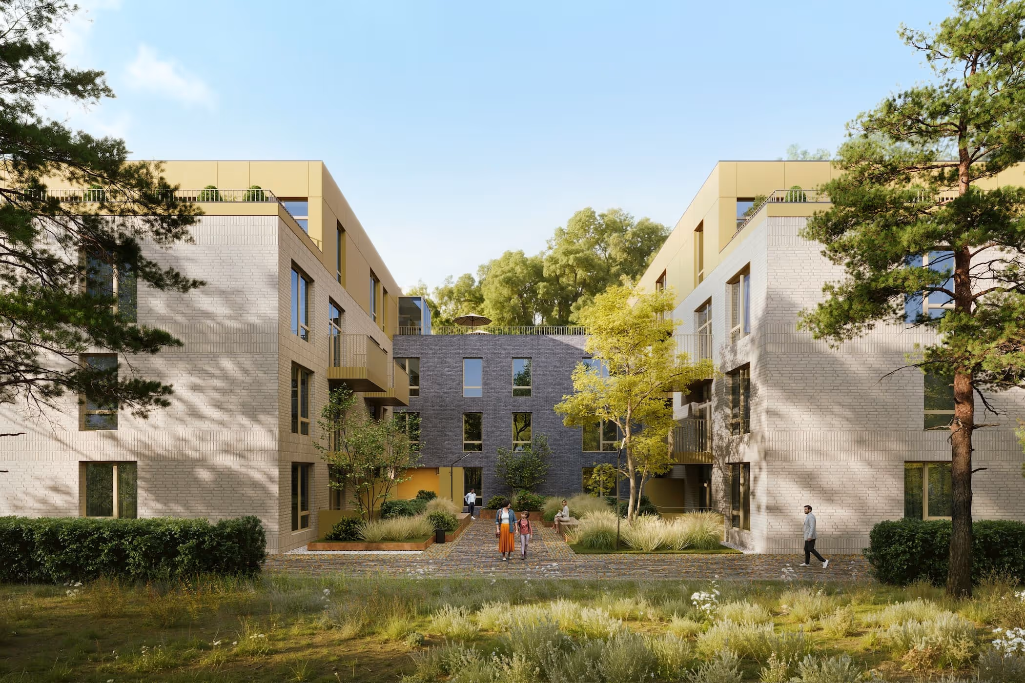 Modern residential buildings with light brick facades, yellow accents, trees, and people walking along a pathway through landscaped greenery.