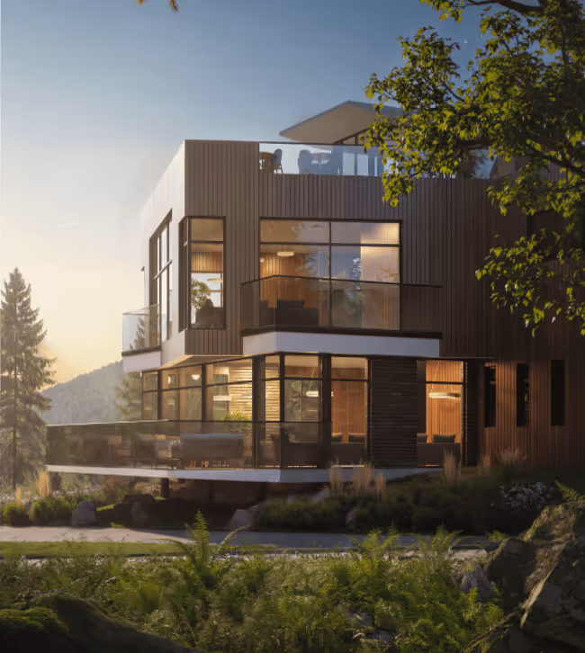 Modern two-story house with large glass windows and balconies surrounded by trees and greenery at sunset.