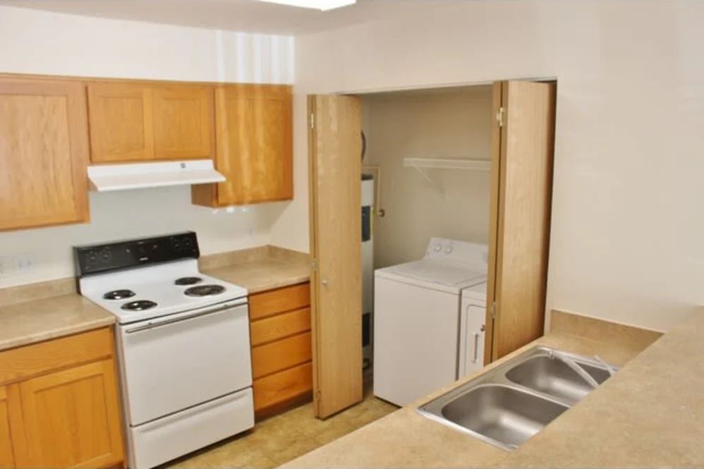 Kitchen with in unit washer and dryer