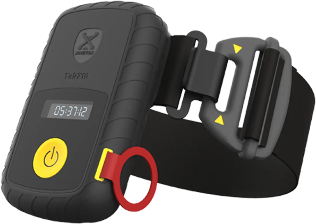 Black wearable electronic device with a digital display, yellow power button, red ring, and adjustable black strap with gray buckle.