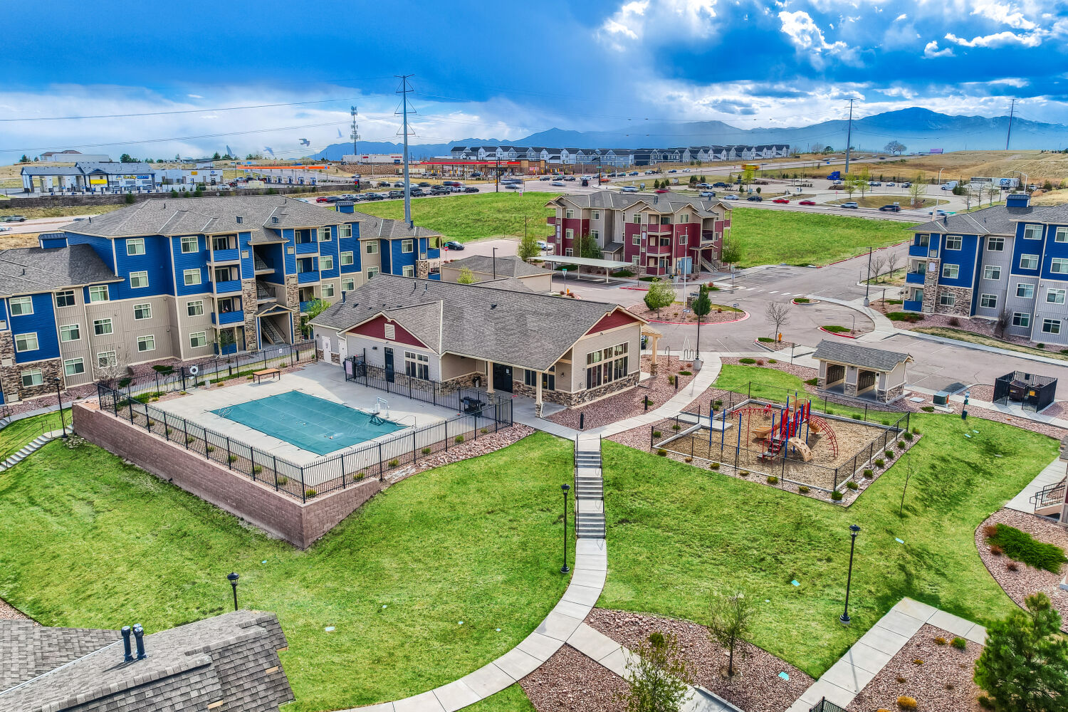 aerial property photo of leasing office, playground and pool