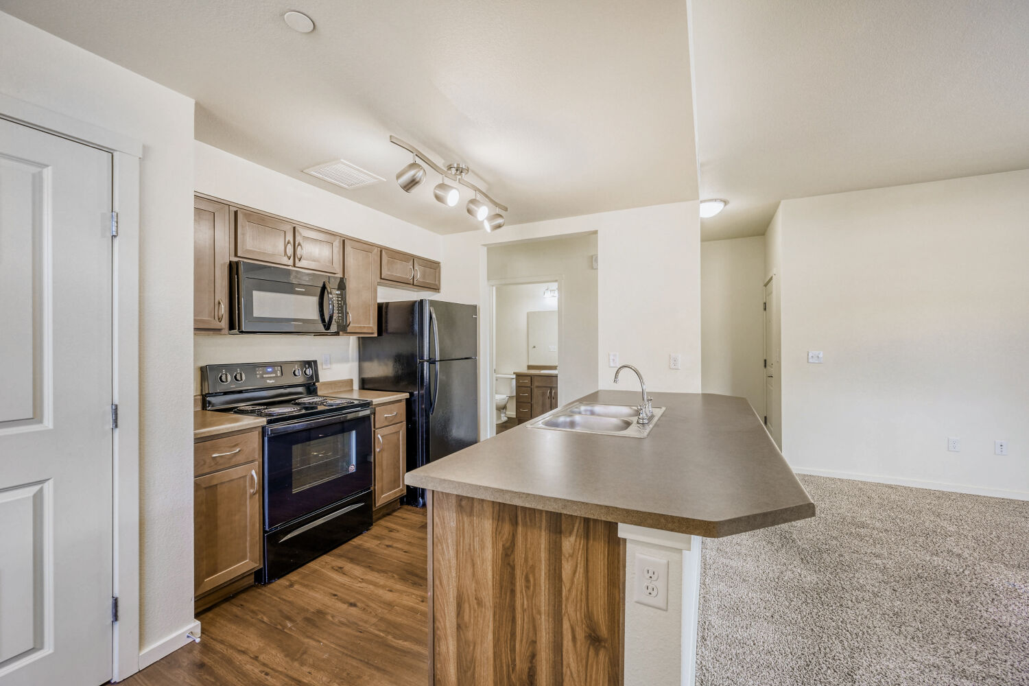 kitchen with black appliances and kitchen island