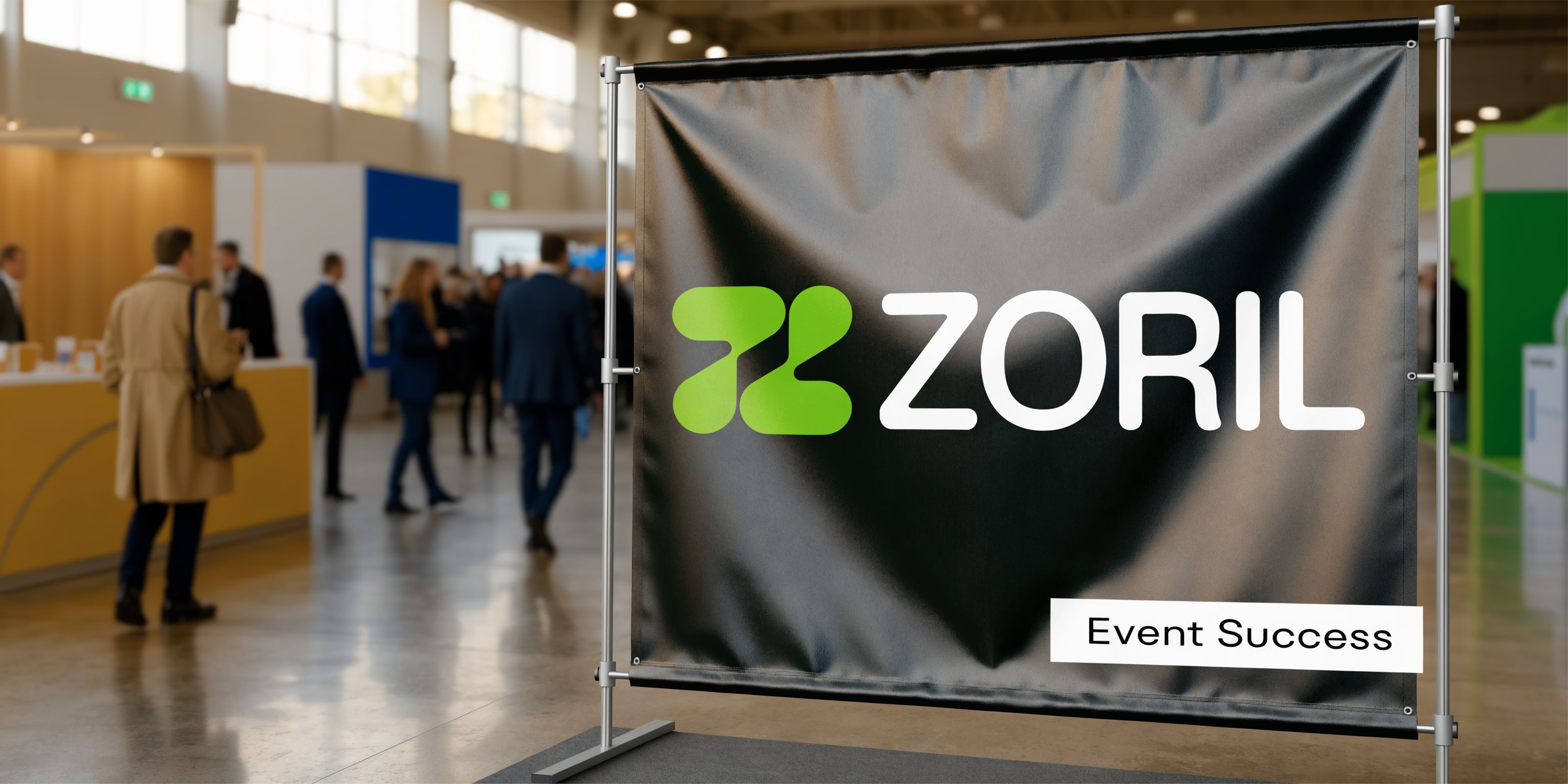 A professional branded pop up banner featuring the Zoril logo at a busy corporate trade show event.