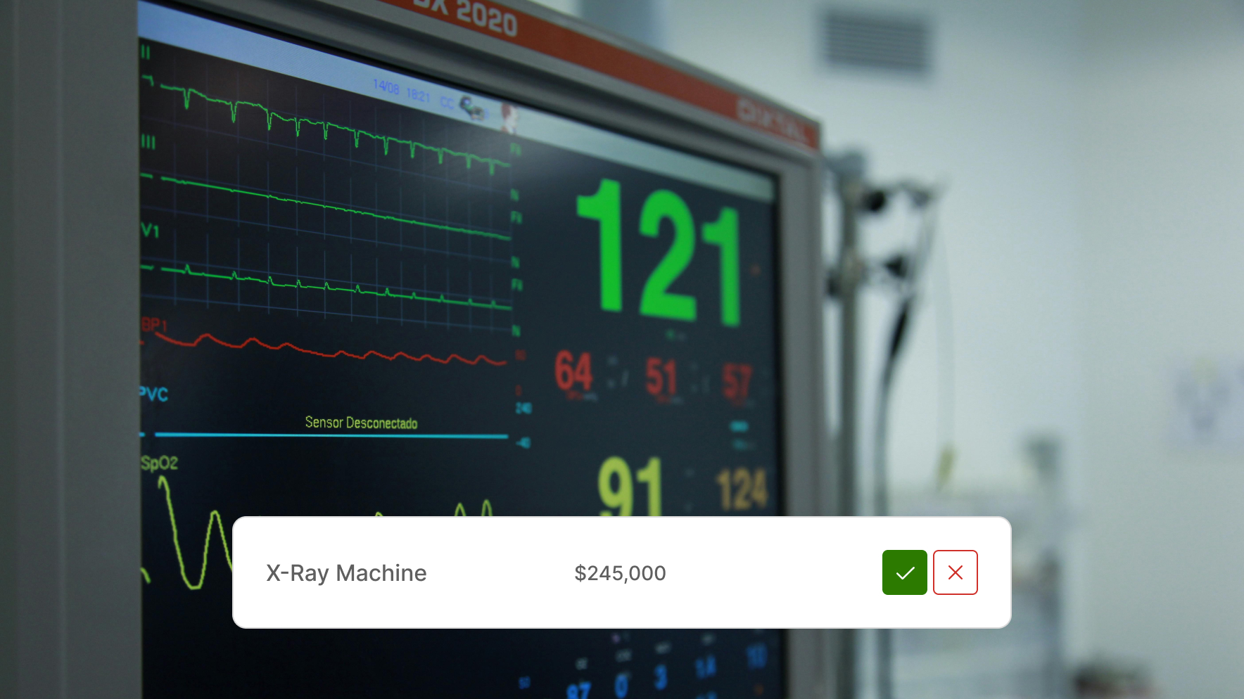 Close-up of a cardiac monitor displaying vital signs with overlay text showing 'Cardiac Monitor $245,000' and check and cancel icons.