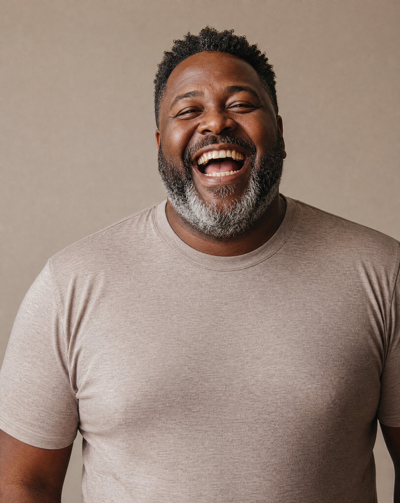 Laughing man in tan t-shirt