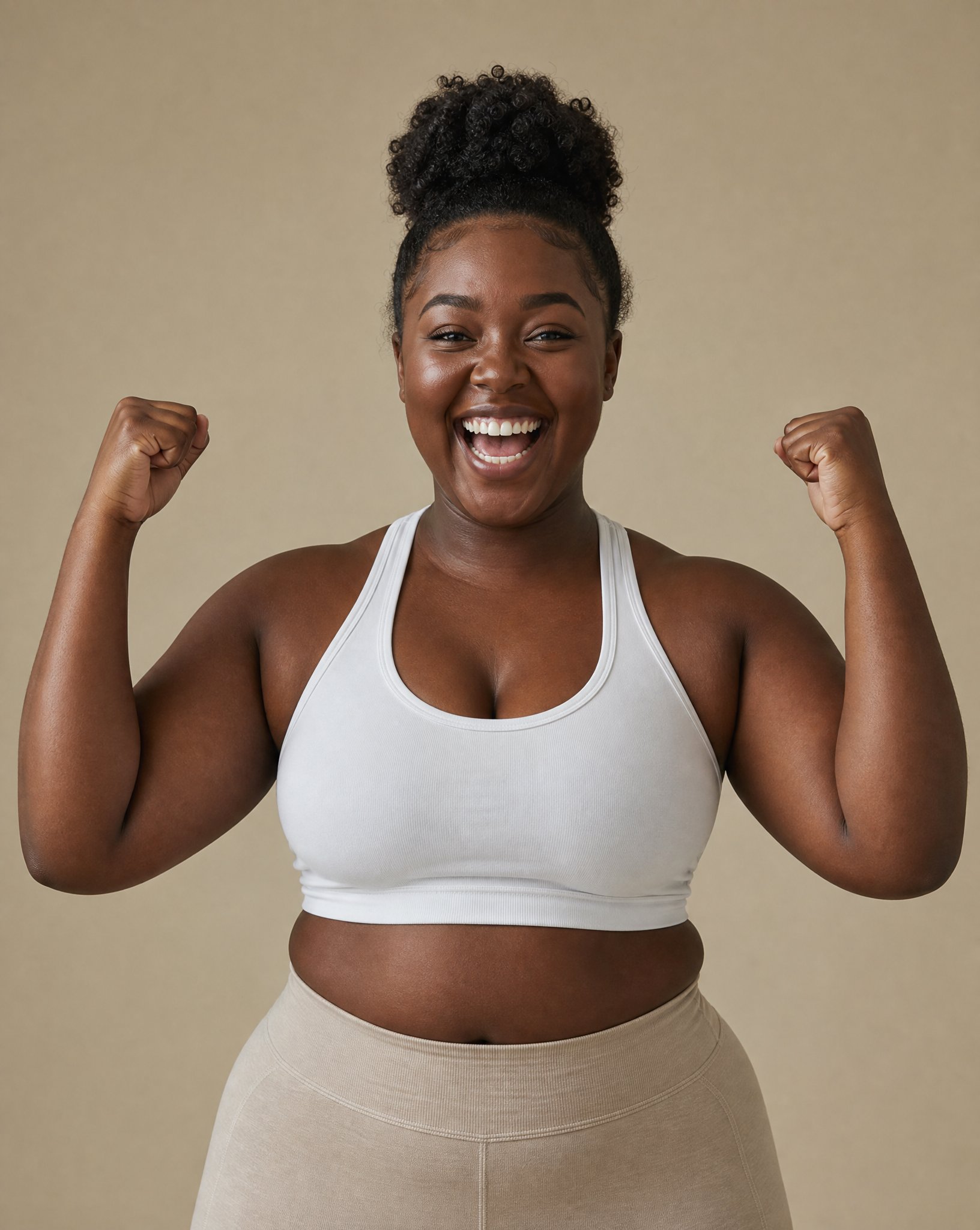 Celebrating woman in white sports bra