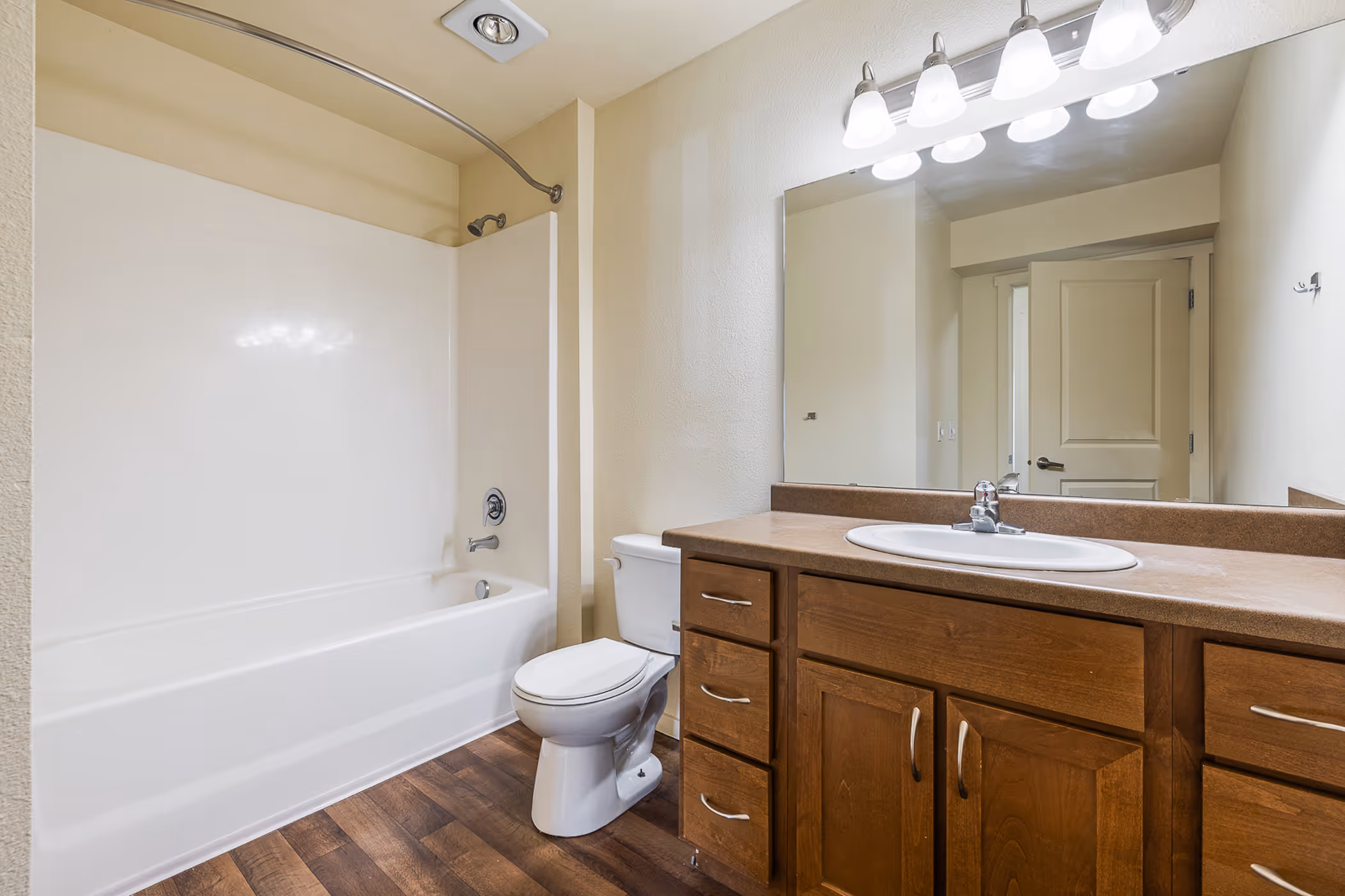 Bathroom with brown cabinets